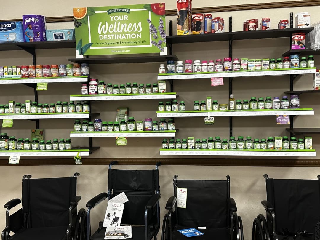 Pharmacist placing medication into a delivery bag